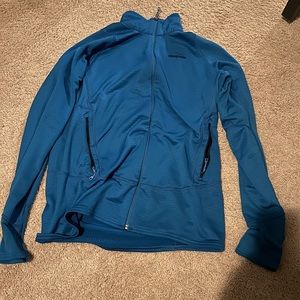 This is a Large Patagonia Zip Up. It is warm and have holes for thumbs.
